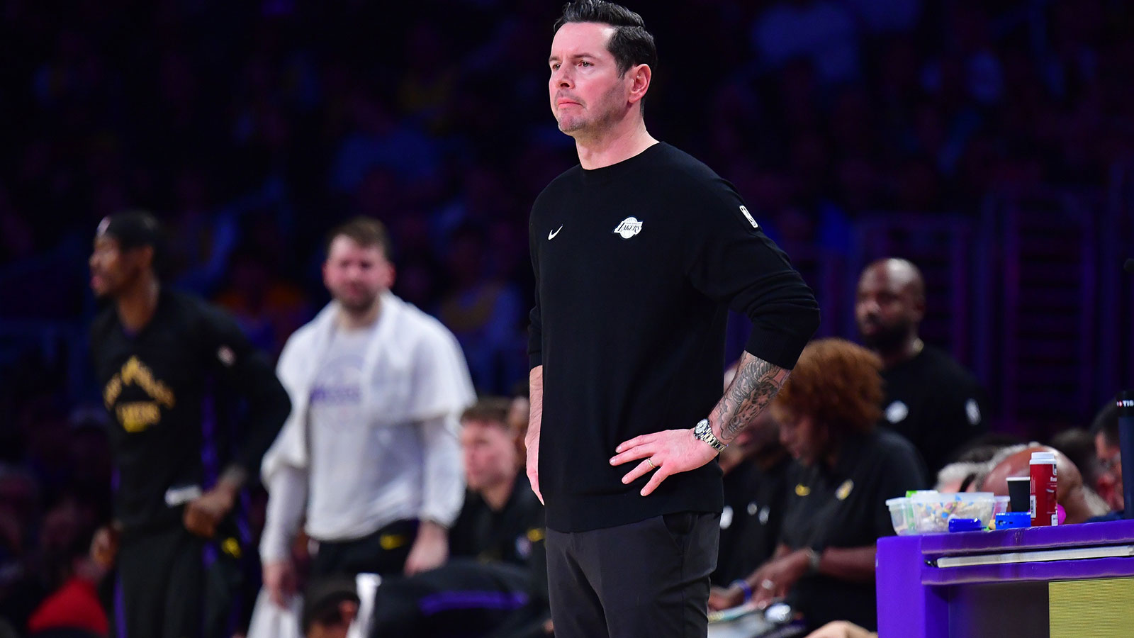 Lakers head coach JJ Redick watches game action against the Houston Rockets during the first half at Crypto.com Arena