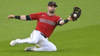 Cleveland Guardians center fielder Lane Thomas (8) makes a sliding catch in the eighth inning against the Toronto Blue Jays at Progressive Field.