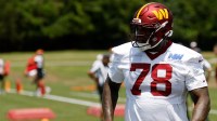 Washington Commanders offensive tackle Laremy Tunsil (78) stands on the field on day one of minicamp at Commanders Park.