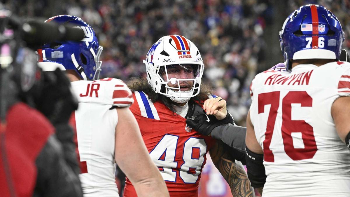 New England Patriots linebacker Jahlani Tavai (48) and New York Giants guard Jon Runyan (76) get into an argument after a hit on New York Giants quarterback Jaxson Dart (6) during the first quarter at Gillette Stadium. Mandatory Credit: Eric Canha-Imagn Images