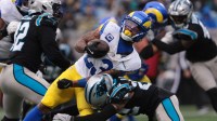 Los Angeles Rams running back Kyren Williams (23) rushes and is tackled by Carolina Panthers safety Lathan Ransom (22) during the second quarter at Bank of America Stadium.