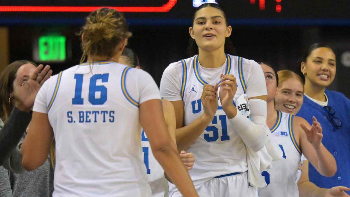 UCLA Bruins forward Sienna Betts (16) is congratulated at the bench by center Lauren Betts (51) during the second half at Pauley Pavilion presented by Wescom Financial.