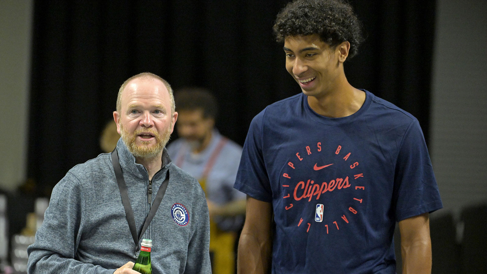 Los Angeles Clippers president of basketball operations Lawrence Frank talks with guard Cam Christie (12) prior to the preseason game against the Brooklyn Nets at Frontwave Arena.