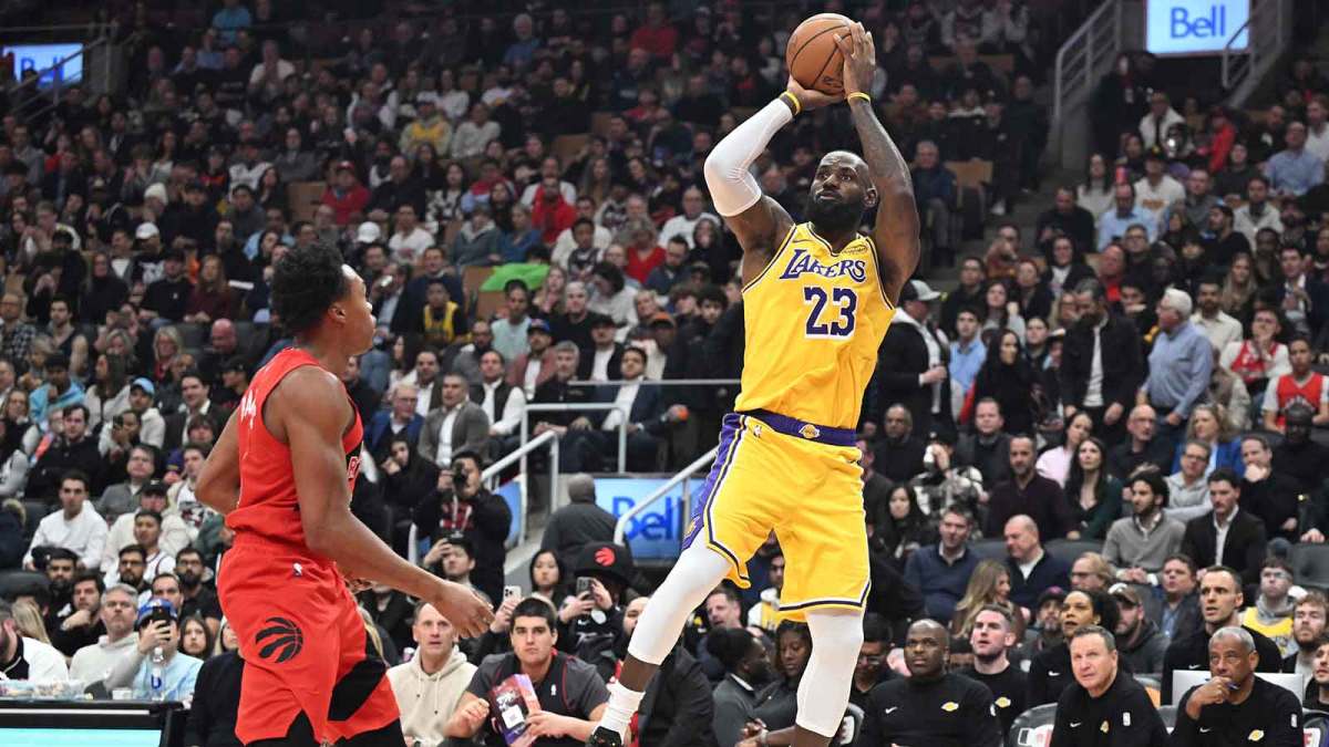 Los Angeles Lakers forward LeBron James (23) shoots the ball over Toronto Raptors forward Scottie Barnes (4) in the first half at Scotiabank Arena.