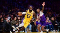 Dec 1, 2025; Los Angeles, California, USA; Los Angeles Lakers forward LeBron James (23) moves the ball against Phoenix Suns guard Jordan Goodwin (23) during the second half at Crypto.com Arena. Mandatory Credit: Gary A. Vasquez-Imagn Images
