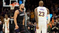 Phoenix Suns forward Dillon Brooks (3) and Los Angeles Lakers forward LeBron James (23) react during an altercation that resulted in a technical for Brooks during the second half of a game at Mortgage Matchup Center.