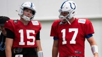 Indianapolis Colts quarterbacks Philip Rivers (17) and Riley Leonard (15) talk Wednesday, Dec. 10, 2025, during practice at the Colts training facility in Indianapolis.