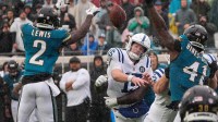 Jacksonville Jaguars cornerback Jourdan Lewis (2) blocks a pass by Indianapolis Colts quarterback Riley Leonard (15) in the second quarter during an NFL football game at EverBank Stadium, Sunday, Dec. 7, 2025, in Jacksonville, Fla.