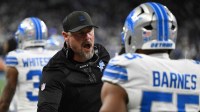 Detroit Lions head coach Dan Campbell celebrates after a play during the first half against the Dallas Cowboys at Ford Field.