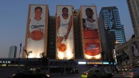 General view of the Lob City mural billboards of Los Angeles Clippers center Blake Griffin (left), guard Chris Paul (center) and center DeAndre Jordan on the side of the Hotel Figueroa.