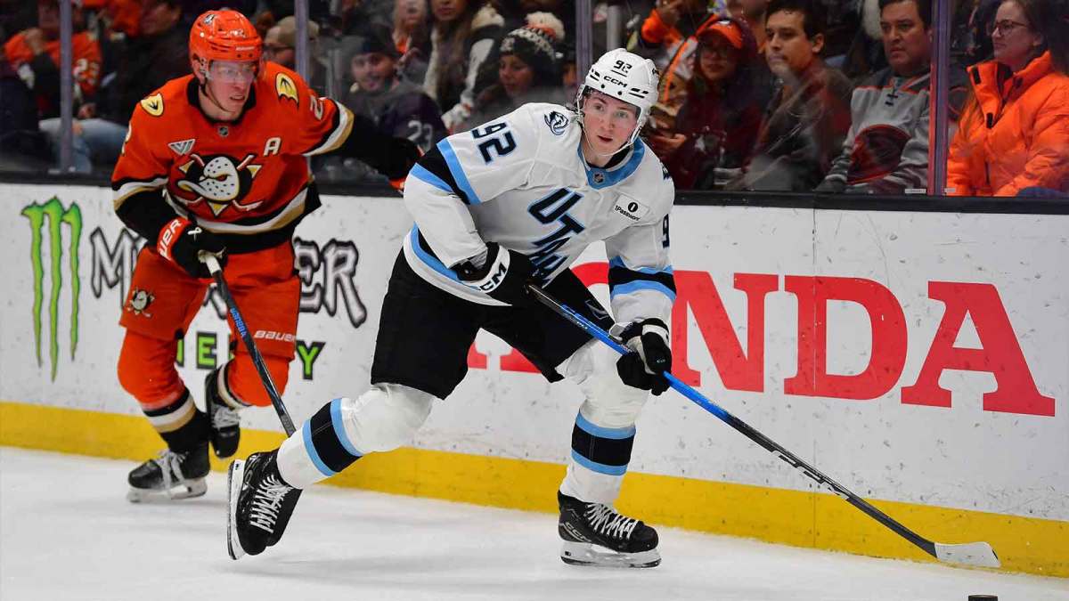 Utah Mammoth center Logan Cooley (92) moves the puck ahead of Anaheim Ducks defenseman Jackson Lacombe (2) during the second period at Honda Center.