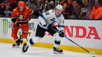 Utah Mammoth center Logan Cooley (92) moves the puck ahead of Anaheim Ducks defenseman Jackson Lacombe (2) during the second period at Honda Center.
