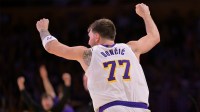 Los Angeles Lakers guard Luka Doncic (77) reacts after a 3-point basket in the second half against the Sacramento Kings at Crypto.com Arena. Mandatory Credit: Jayne Kamin-Oncea-Imagn Images