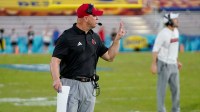 Dec 23, 2025; Boca Raton, FL, USA; Louisville Cardinals head coach Jeff Brohm signals to his team during a time out in the fourth quarter of the Boca Raton Bowl at Flagler CU Stadium. Mandatory Credit: Jeff Romance-Imagn Images