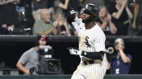 Chicago White Sox outfielder Luis Robert Jr. (88) gestures after he hits a home run during the eighth inning against the Minnesota Twins at Rate Field.