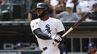 Chicago White Sox center fielder Luis Robert Jr. (88) singles against the Minnesota Twins during the first inning at Rate Field.