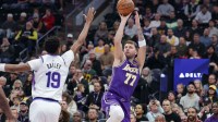 Los Angeles Lakers forward/guard Luka Doncic (77) shoots over Utah Jazz forward Ace Bailey (19) during the first quarter at Delta Center.