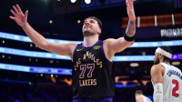 Los Angeles Lakers guard Luka Doncic (77) reacts after scoring a basket against the Detroit Pistons during the second half at Crypto.com Arena.