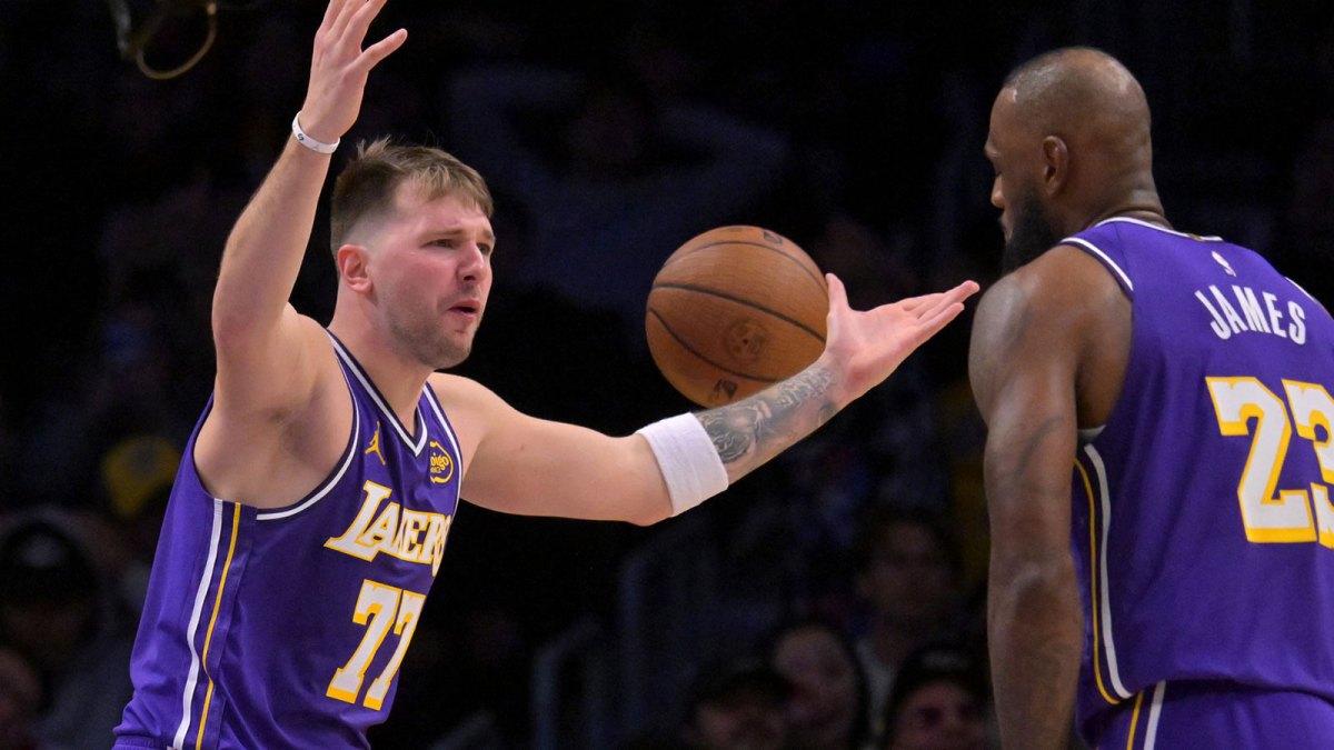 Los Angeles Lakers guard Luka Doncic (77) and forward Lebron James (23) react after a foul call during the second half against the San Antonio Spurs at Crypto.com Arena.