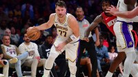 Los Angeles Lakers guard Luka Doncic (77) controls the ball against the Houston Rockets during the first half at Crypto.com Arena.