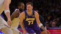 Los Angeles Lakers guard Luka Doncic (77) drives past Los Angeles Clippers forward Kawhi Leonard (2) during the first half at Crypto.com Arena. Mandatory Credit: Jayne Kamin-Oncea-Imagn Images