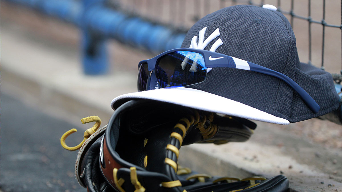 A general view of New York Yankees hat, sunglasses and glove in the dugout against the New York Mets at George M. Steinbrenner Field.