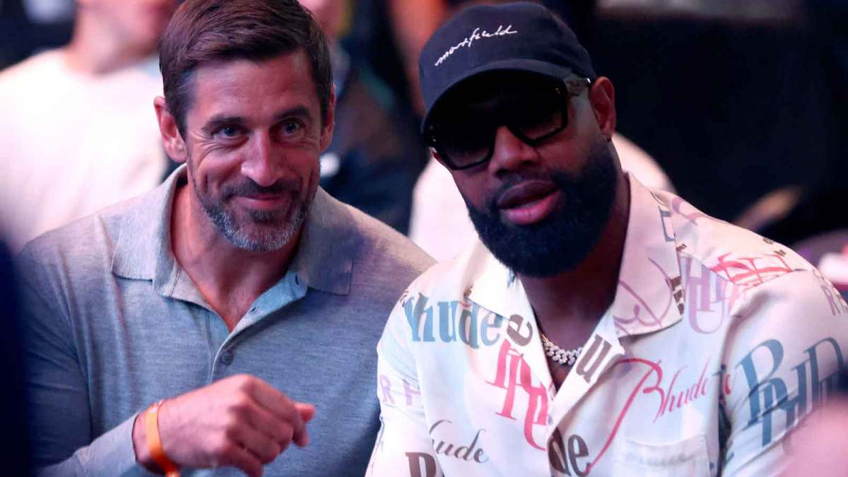 New York Jets quarterback Aaron Rodgers and Chicago Bears tight end Marcedes Lewis during UFC 303 at T-Mobile Arena.