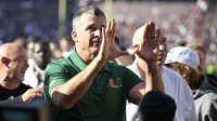Miami Hurricanes head coach Mario Cristobal celebrates after defeating the Texas A&M Aggies in the first round game of the CFP National Playoff at Kyle Field.