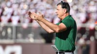 Miami (FL) Hurricanes head coach Mario Cristobal signals for his team during the second quarter against the Virginia Tech Hokies at Lane Stadium.