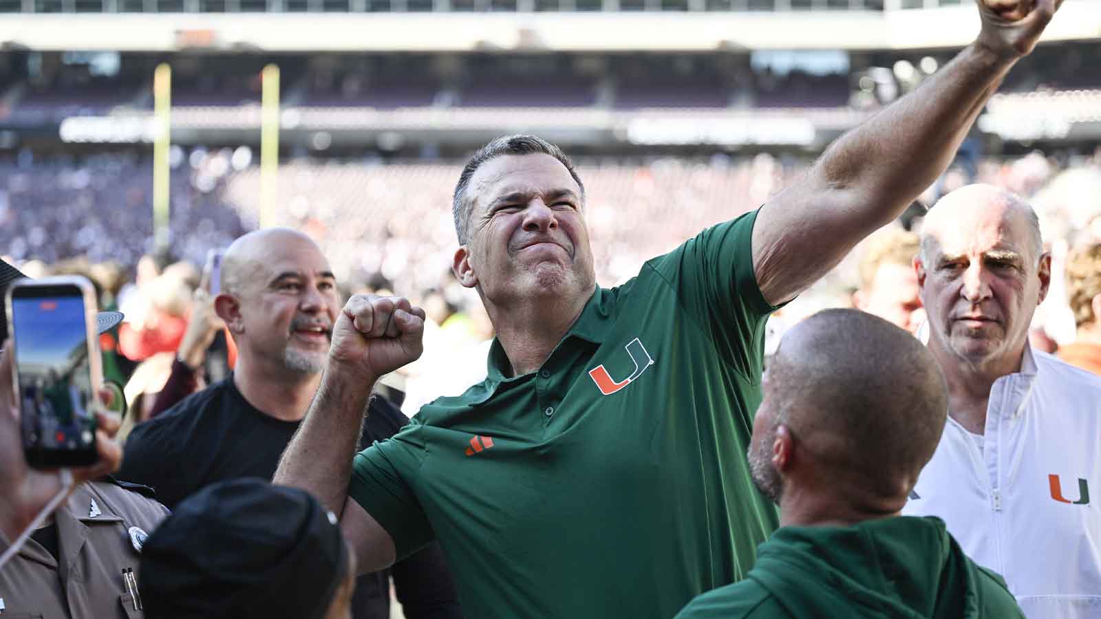 Miami Hurricanes head coach Mario Cristobal celebrates after defeating the Texas A&M Aggies in the first round game of the CFP National Playoff at Kyle Field. 
