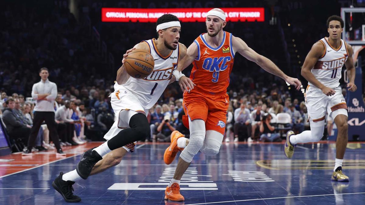 Phoenix Suns guard Devin Booker (1) drives past Oklahoma City Thunder guard Alex Caruso (9) during the second quarter at Paycom Center.