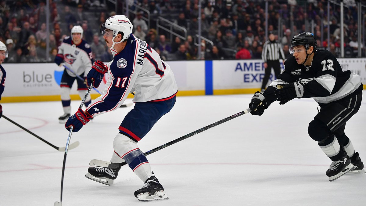 Columbus Blue Jackets left wing Mason Marchment (17) shoots ahead of Los Angeles Kings left wing Trevor Moore (12) during the third period at Crypto.com Arena.