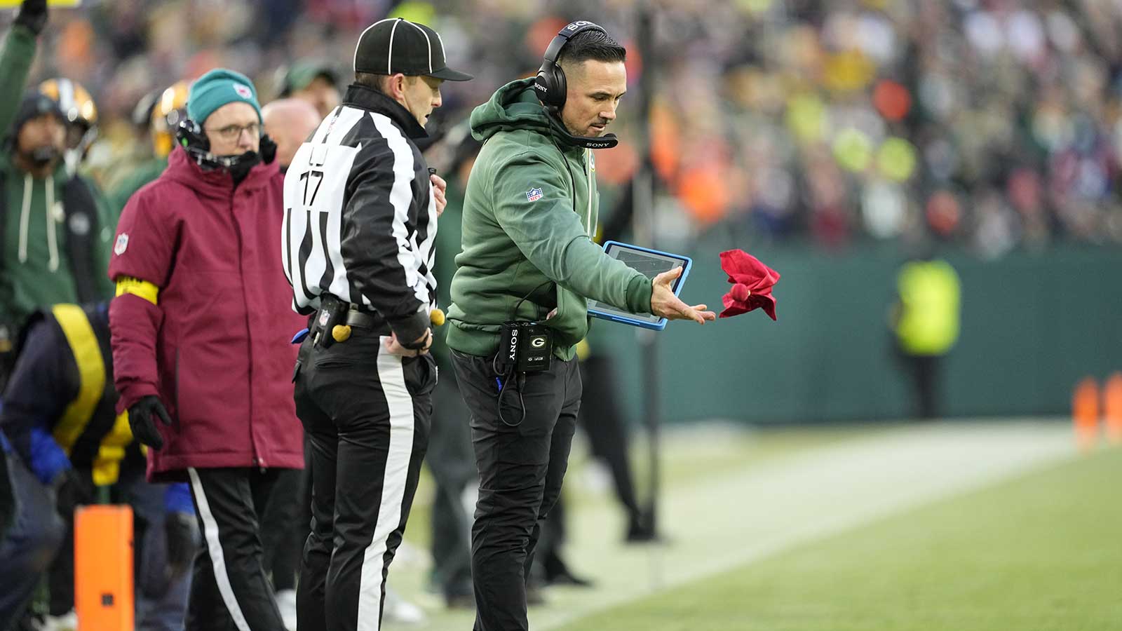 Green Bay Packers head coach Matt LaFleur challenges a fumble call in the first quarter against the Chicago Bears at Lambeau Field. Mandatory Credit: Jeff Hanisch-Imagn Images