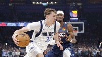 Mavericks forward Cooper Flagg (32) drives to the basket around Oklahoma City Thunder guard Shai Gilgeous-Alexander (2) during the second quarter at Paycom Center