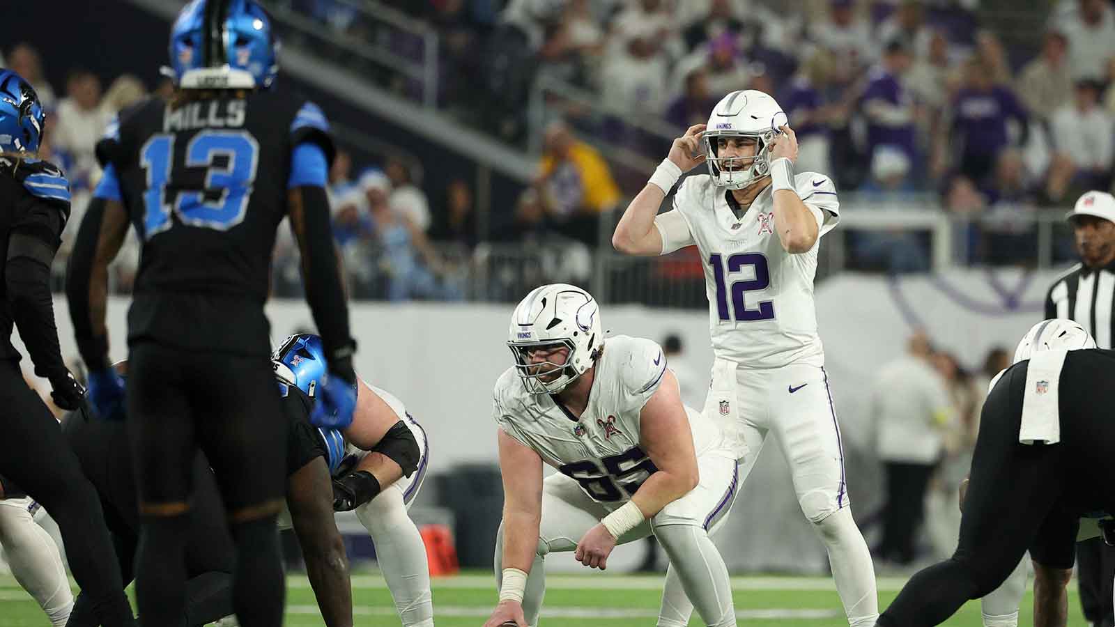 Minnesota Vikings quarterback Max Brosmer (12) calls a play at the line of scrimmage against the Detroit Lions in the third quarter at U.S. Bank Stadium.