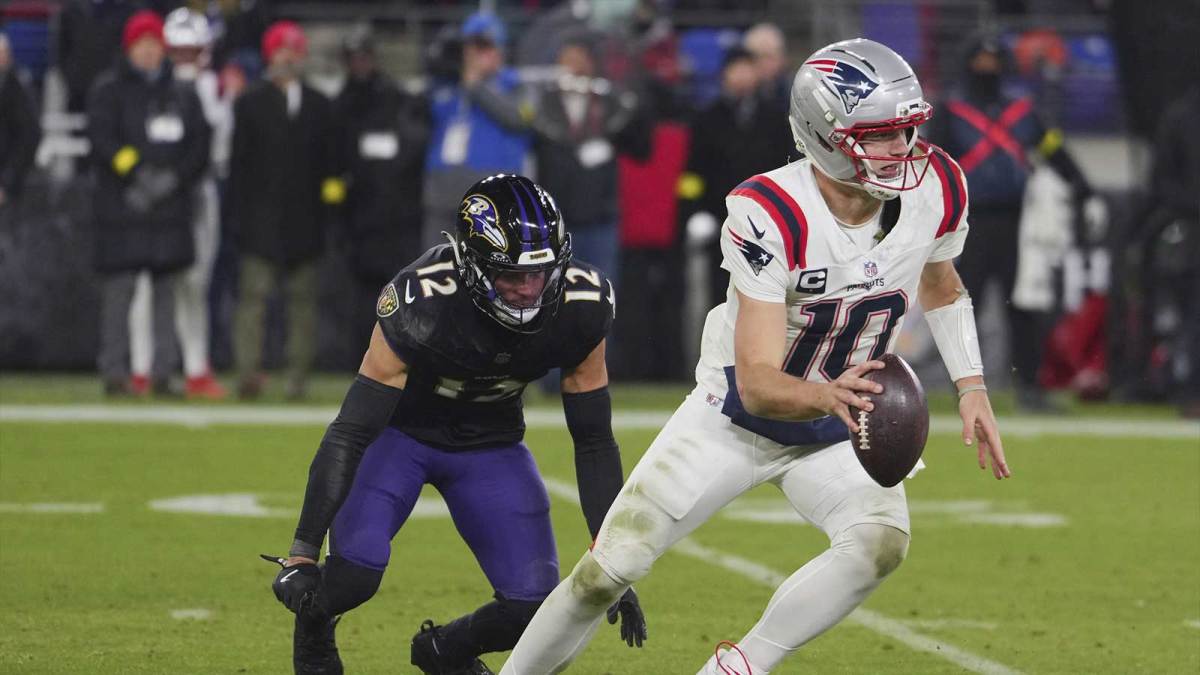 New England Patriots quarterback Drake Maye (10) scrambles against Baltimore Ravens safety Alohi Gilman (12) during the second half of the game at M&T Bank Stadium.