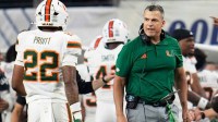 Miami Hurricanes head coach Mario Cristobal reacts beside linebacker Cameron Pruitt (22) during the Cotton Bowl at AT&T Stadium in Arlington, Texas for the College Football Playoff quarterfinal game against the Ohio State Buckeyes on Dec. 31, 2025.