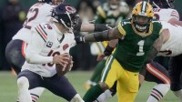 Green Bay Packers defensive end Micah Parsons (1) pressures Chicago Bears quarterback Caleb Williams (18) during the first quarter of their game Sunday, December 7, 2025 at Lambeau Field in Green Bay, Wisconsin.