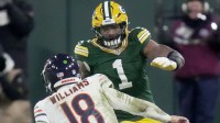 Green Bay Packers defensive end Micah Parsons (1) pressures Chicago Bears quarterback Caleb Williams (18) during the fourth quarter of their game Sunday, December 7, 2025 at Lambeau Field in Green Bay, Wisconsin. The Green Bay Packers beat the Chicago Bears 28-21.