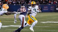 Green Bay Packers running back Josh Jacobs (8) runs with the ball against Chicago Bears cornerback Nahshon Wright (26) during the first quarter at Soldier Field