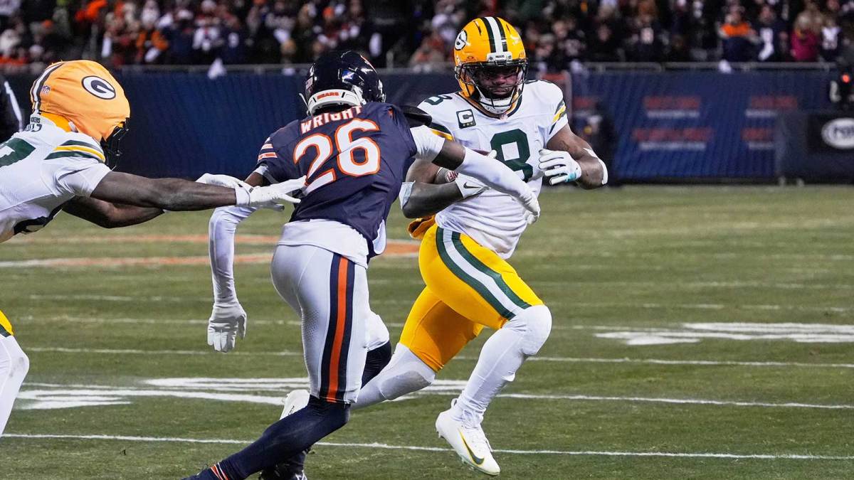 Green Bay Packers running back Josh Jacobs (8) runs with the ball against Chicago Bears cornerback Nahshon Wright (26) during the first quarter at Soldier Field