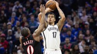 Brooklyn Nets forward Michael Porter Jr. (17) shoots in front of Philadelphia 76ers guard Tyrese Maxey (0) during the second quarter at Xfinity Mobile Arena.