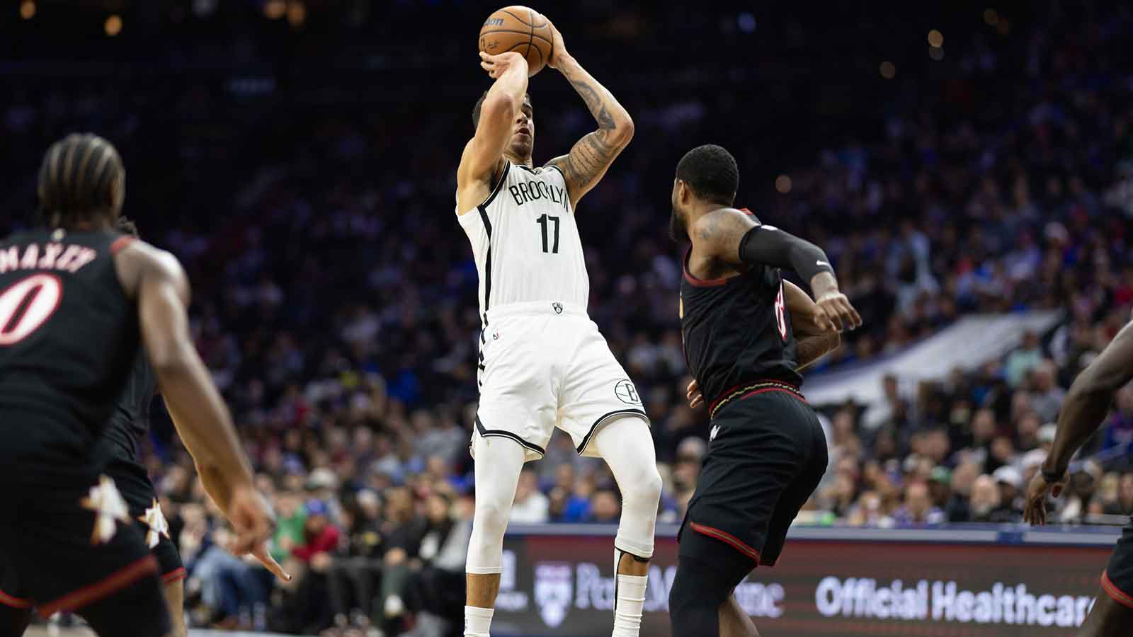 Brooklyn Nets forward Michael Porter Jr. (17) shoots in front of Philadelphia 76ers forward Paul George (8) during the second quarter at Xfinity Mobile Arena.