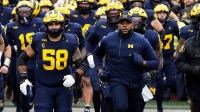 Michigan Wolverines head coach Sherrone Moore leads his team onto the field for the NCAA football game against the Ohio State Buckeyes at Michigan Stadium in Ann Arbor, Mich. on Nov. 29, 2025. Ohio State won 27-9.