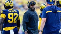 Michigan head coach Sherrone Moore talks to players at a timeout against USC during the second half at Michigan Stadium in Ann Arbor on Saturday, Sept. 21, 2024.