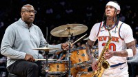 Madison Square Garden Mike Brown Knicks sitting at a drum set and Jordan Clarkson Knicks holding/playing a saxophone