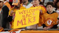 A Tampa Bay Buccaneers fan holds up a sign welcoming wide receiver Mike Evans (13) back from injured reserve before the game against the Atlanta Falcons at Raymond James Stadium. Mandatory Credit: Nathan Ray Seebeck-Imagn Images