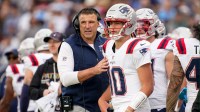 New England Patriots coach Mike Vrabel talks to quarterback Drake Maye (10) during the second quarter at Nissan Stadium in Nashville, Tenn., Sunday, Oct. 19, 2025.