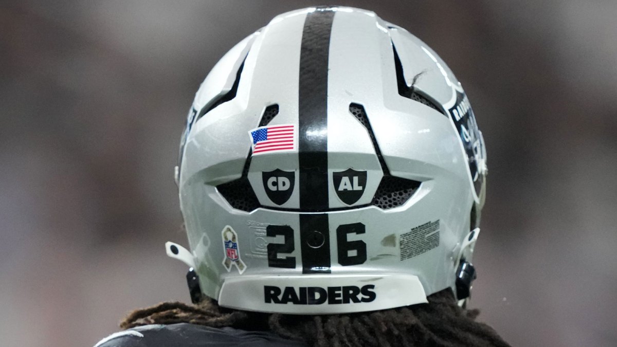 A detailed view of CD ad AL decals in the memory of Carol Davis and Al Davis on the back of the helmet of Las Vegas Raiders cornerback Darien Porter (26) during the game against the Jacksonville Jaguars at Allegiant Stadium.