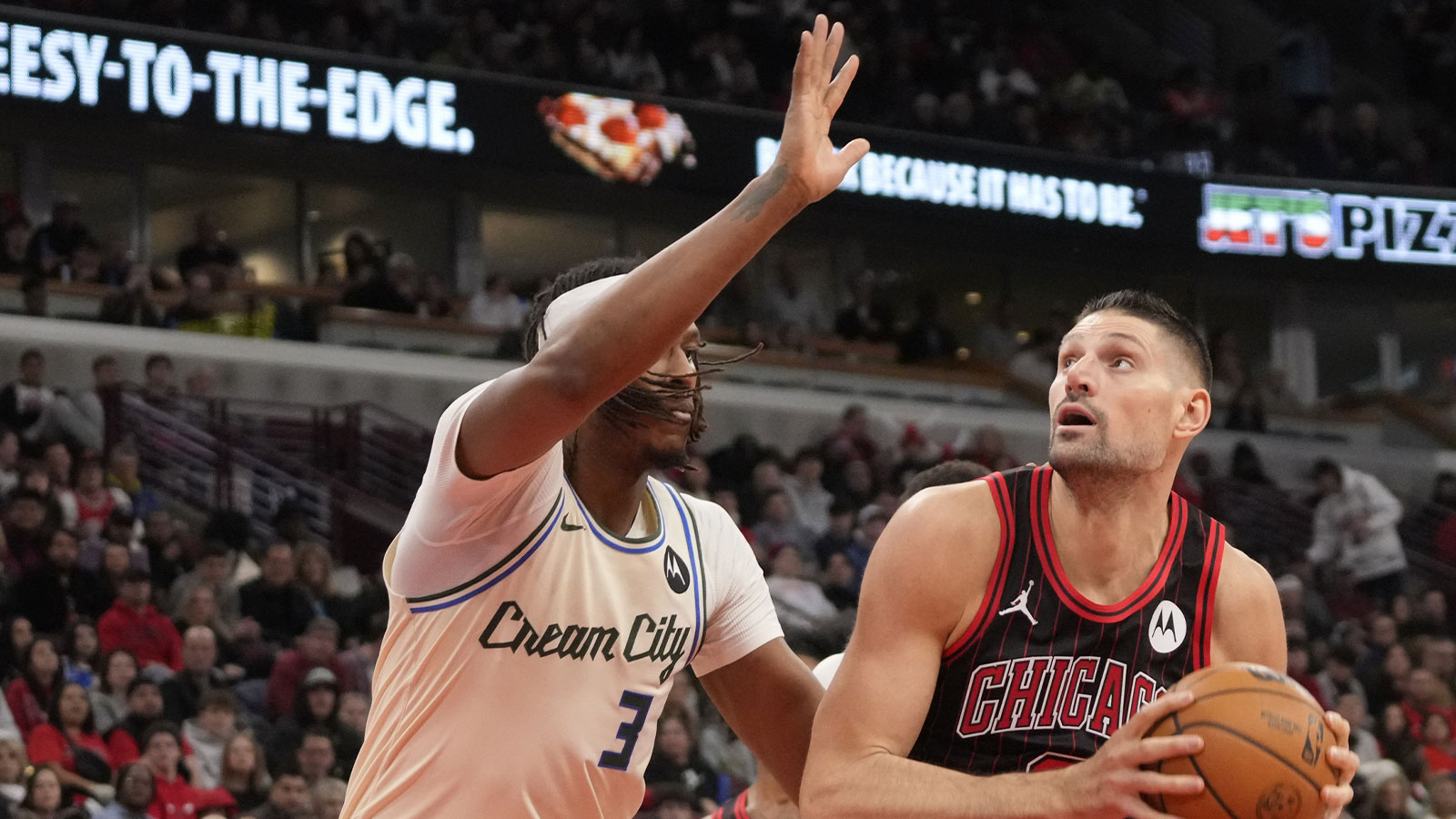 Milwaukee Bucks center Myles Turner (3) defends Chicago Bulls center Nikola Vucevic (9) during the first half at United Center.